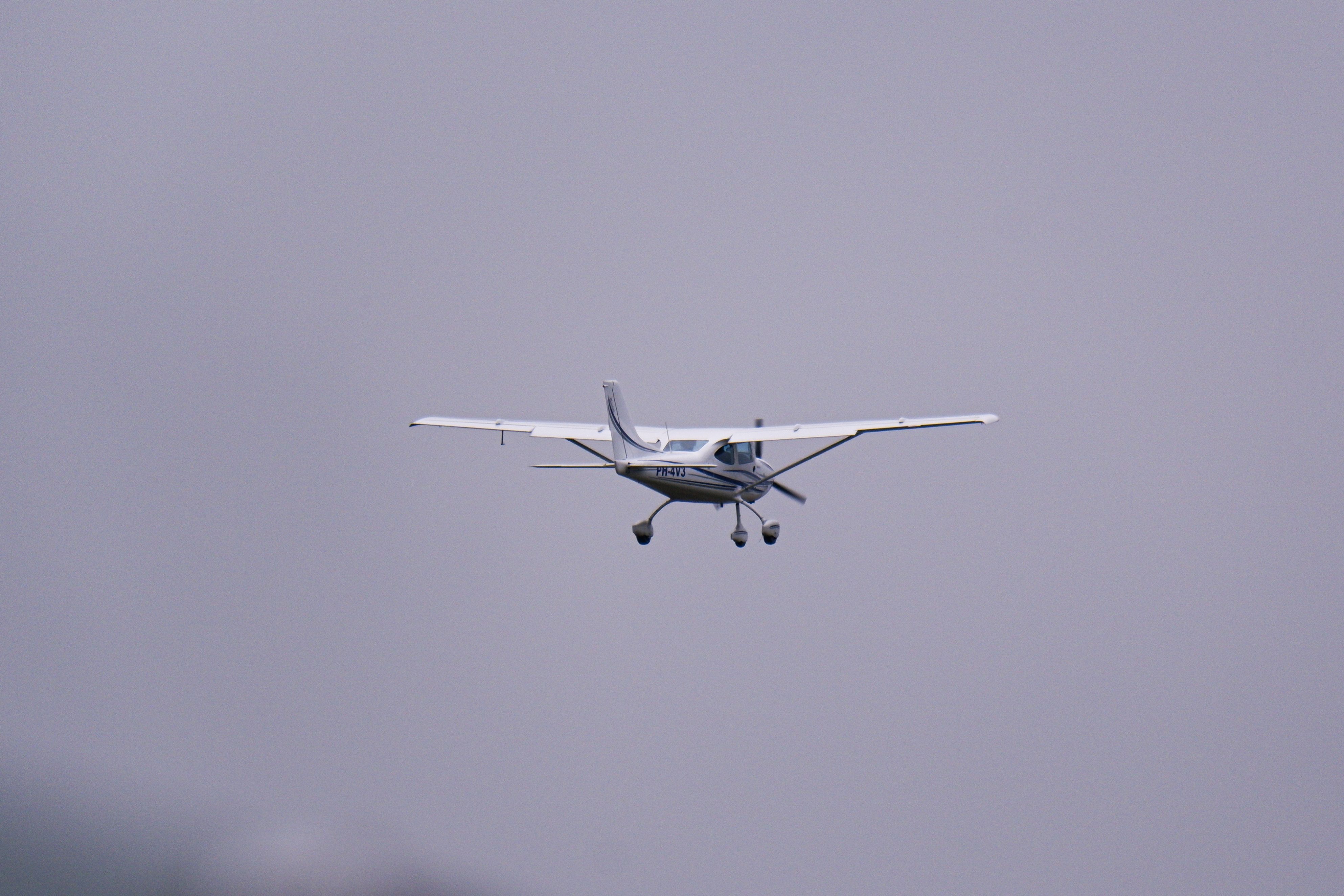 White Airplane Flying in the Sky · Free Stock Photo