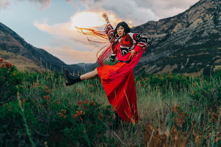 Woman On A Fashion Photoshoot Posing In Mountains 