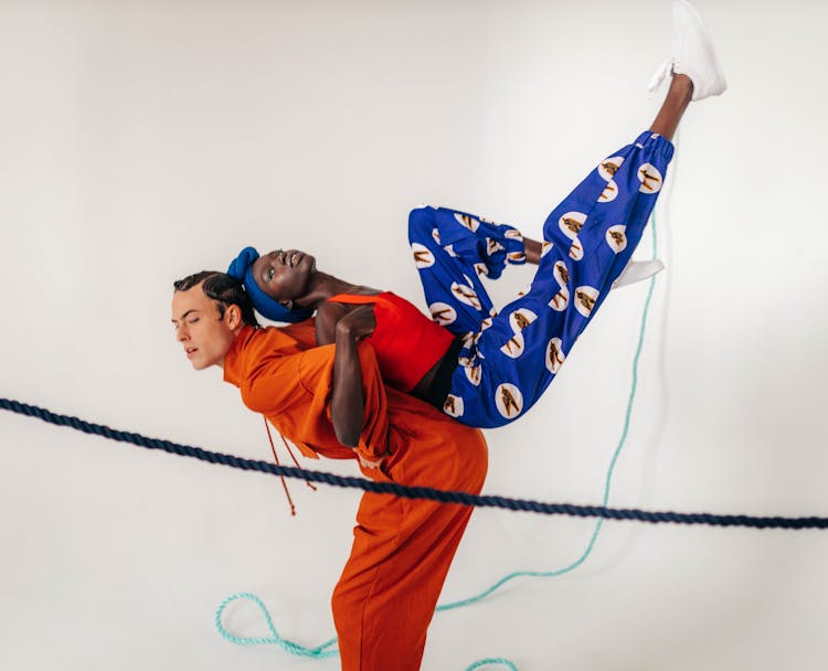 Man And Woman In A Dynamic Pose On A Fashion Photoshoot 