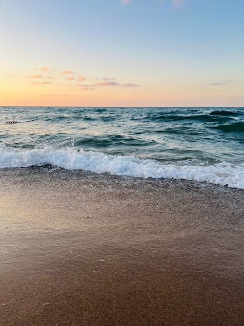 Crashing Ocean Waves on the Sea Shore during Sunset