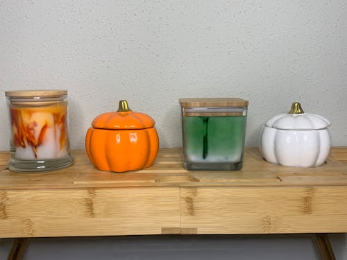 Glass Jars and Ceramic Containers on a Wooden Surface