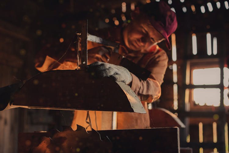 Man Working At The Saw