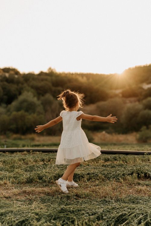 Little Girl Wearing White Dress while Standing on Green Grass · Free ...