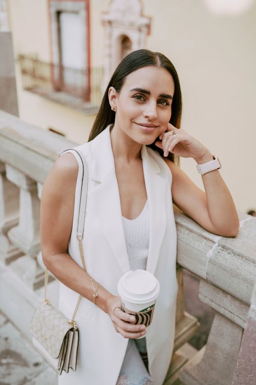 Smiling Woman Holding Coffee