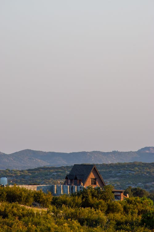 Brown Wooden House Near Green Mountain