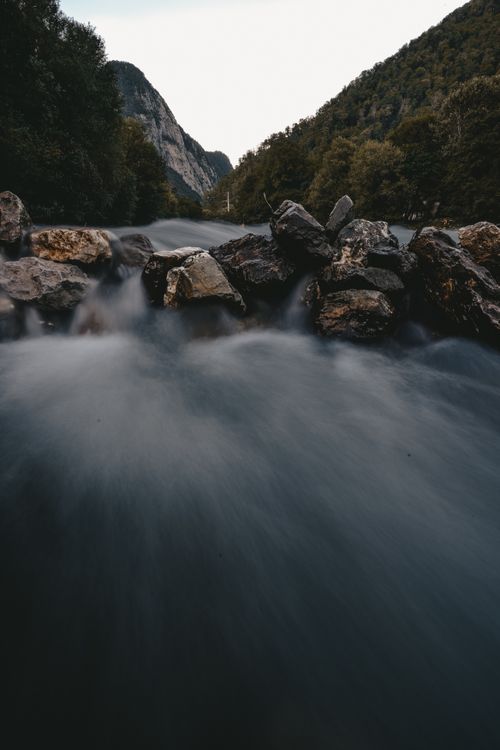 Free Long exposure of a tranquil stream flowing through rocky terrain in Sochi, Russia. Stock Photo