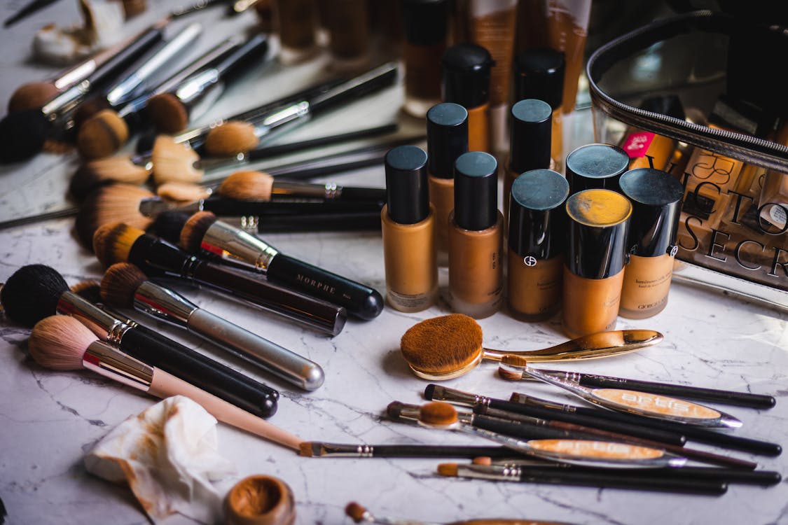 A Close-Up Shot of Various Makeup and Brushes · Free Stock Photo