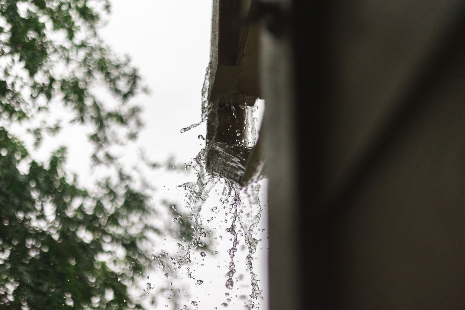 Rainwater running cleanly off a new gutter line