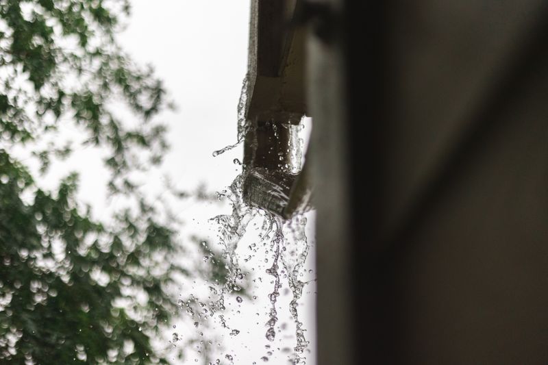 Underground Downspouts & French Drains: Solving Roof Drainage Problems