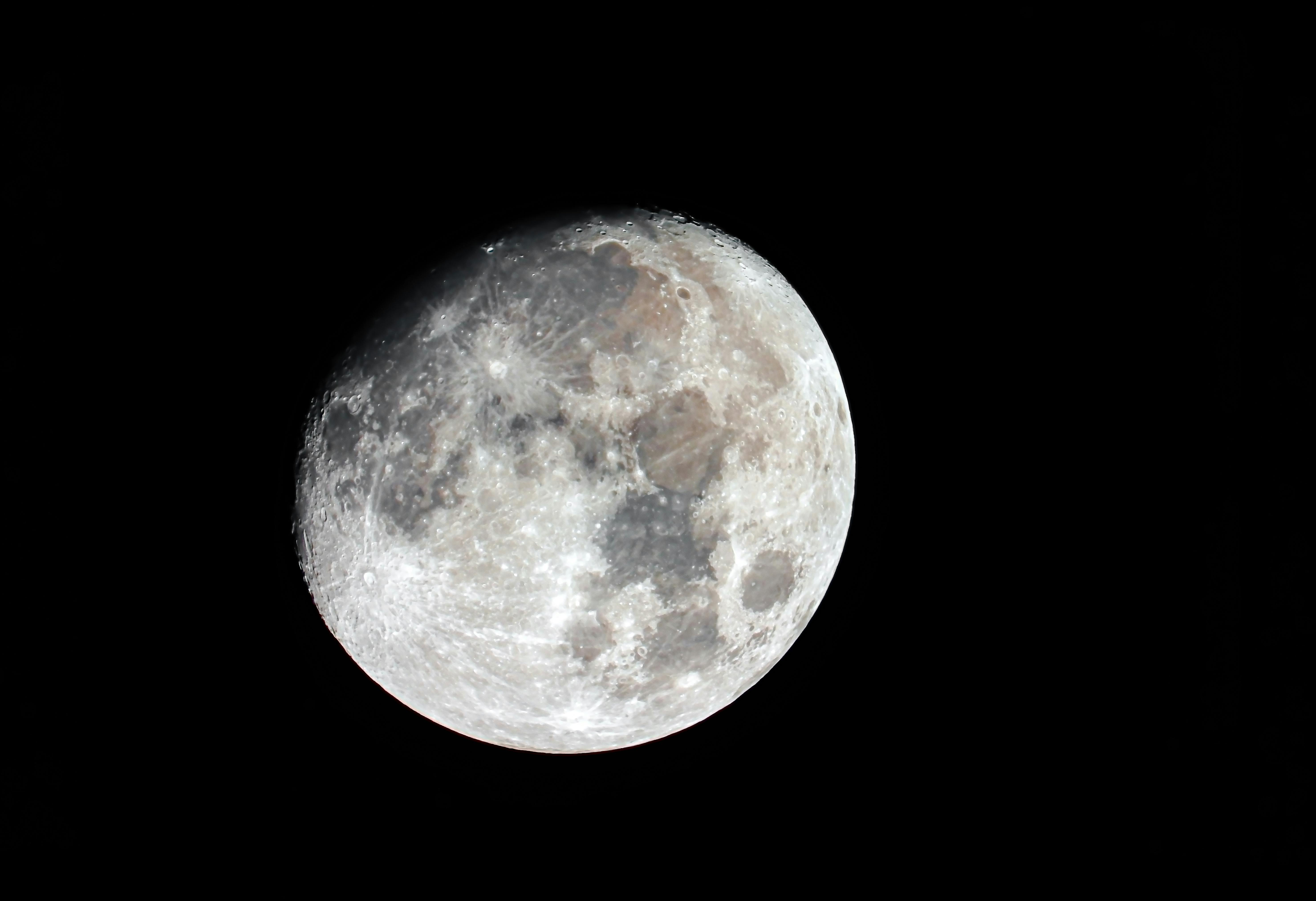 Crisp and detailed close-up of the full moon set against a dark night sky.