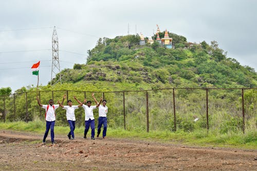 People Standing on Green Grass Field