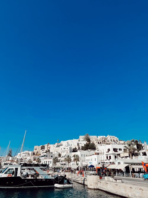 Free Explore the charming harbor of Naxos Island, Greece. Perfect for travel enthusiasts. Stock Photo
