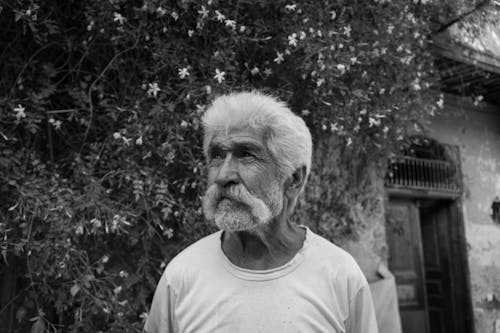 Elderly Man in Grayscale Photography