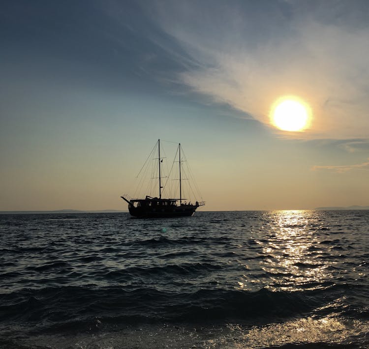 Silhouette Of Ship On Sea