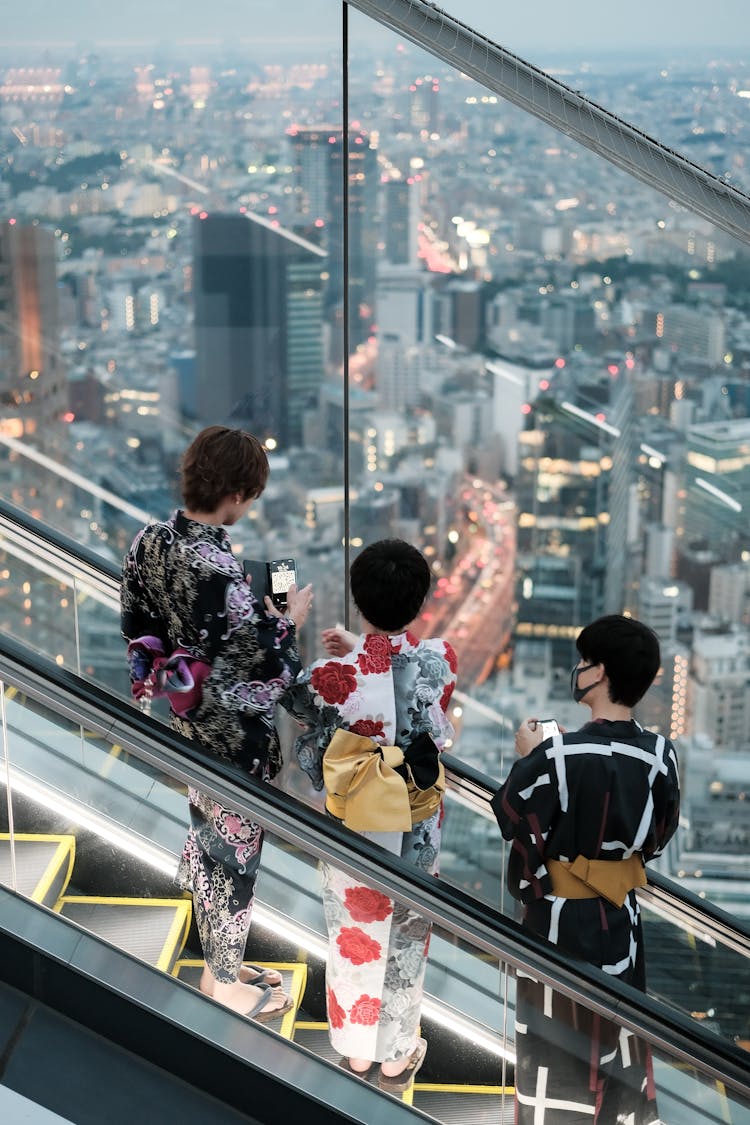 People Standing On An Escalator