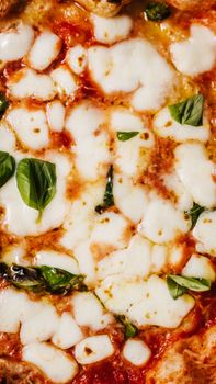 A close-up shot of a delicious Margherita pizza with mozzarella and basil.