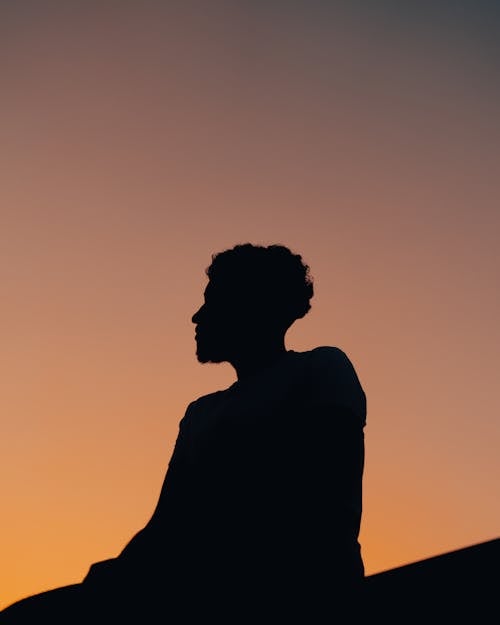Silhouette of a Person During Dusk