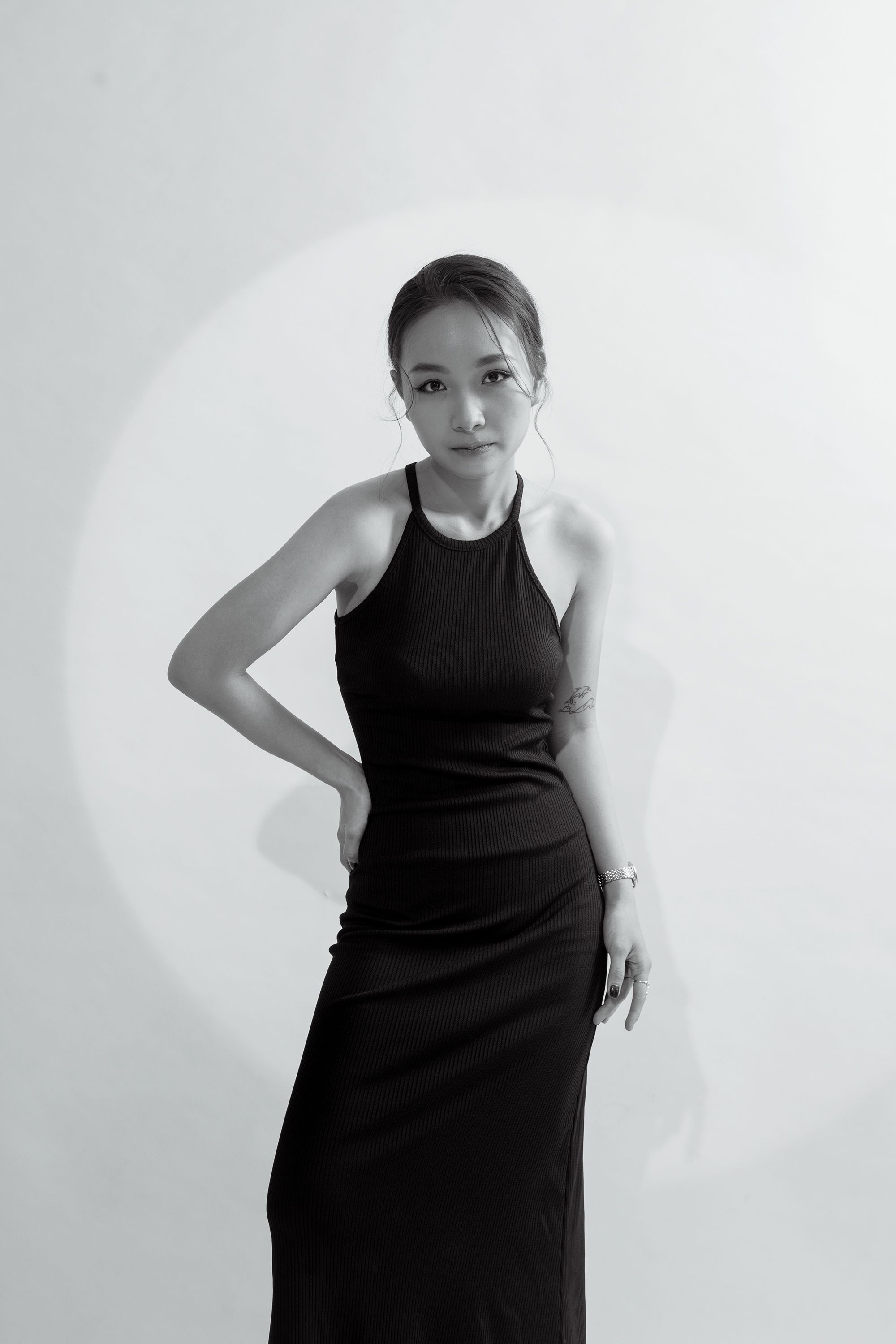 Grayscale Photo of a Woman in Black Dress · Free Stock Photo