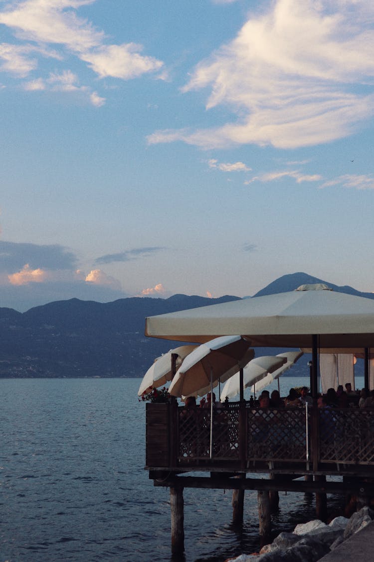 Cafe Outdoor Terrace With Umbrellas In Water