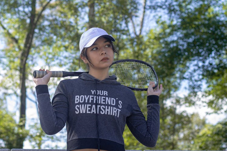 Young Woman Holding A Badminton Racket 