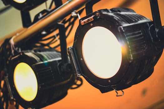 Detailed view of illuminated stage spotlights casting soft warm light