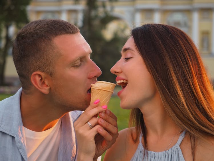 Man And Woman Sharing An Ice Cream