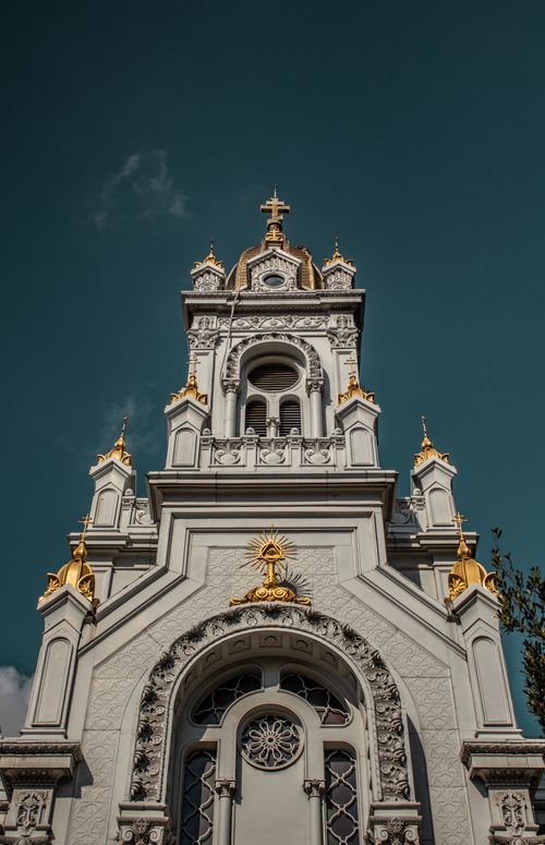 Free Low angle view of the ornate Şişli Saint Stephen Church tower in Istanbul against a clear blue sky. Stock Photo