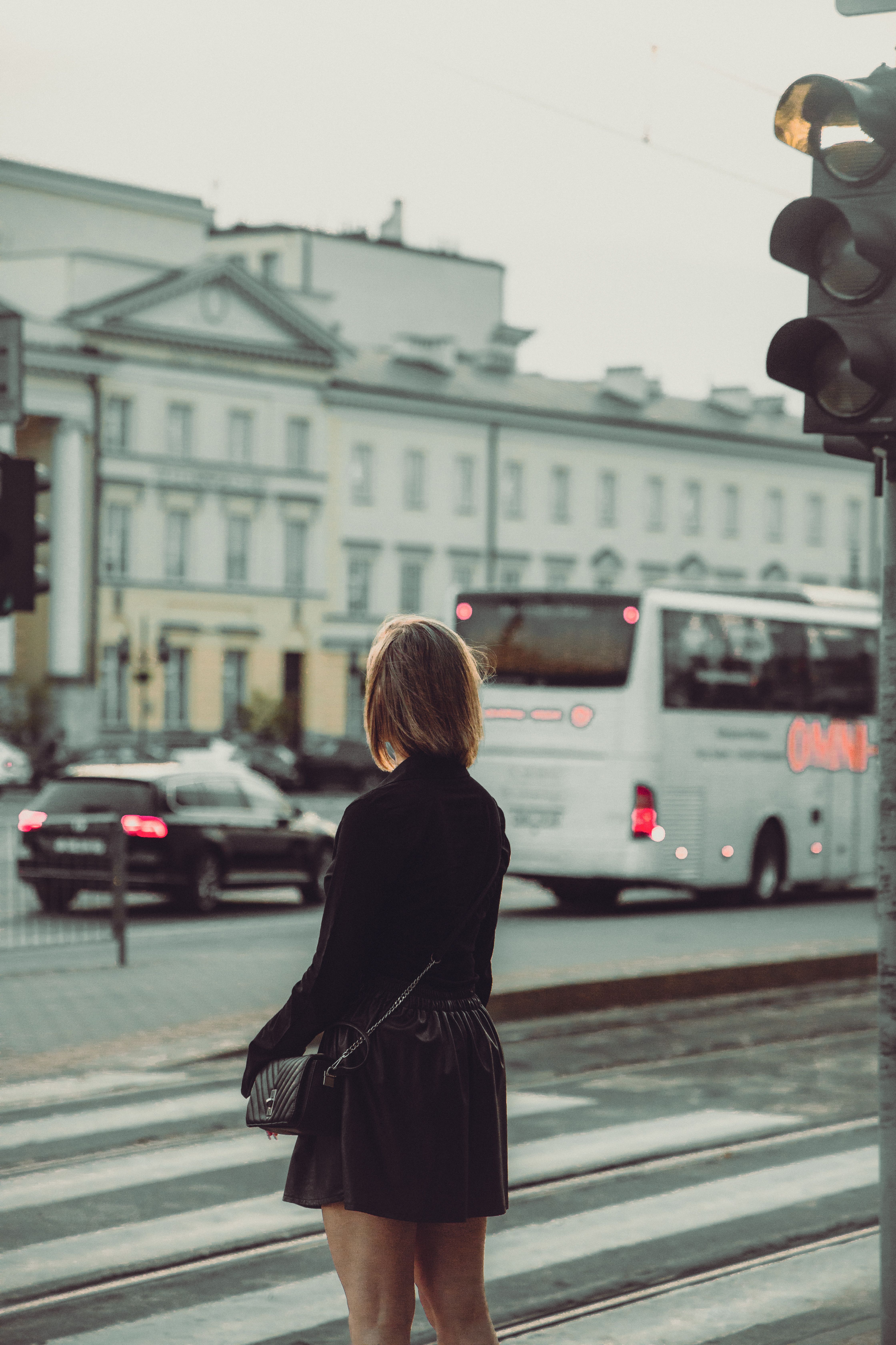 Woman in Skirt Standing near Crosswalk · Free Stock Photo