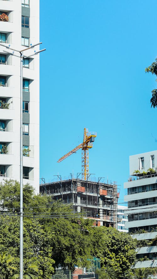 A Yellow Tower Crane in a Construction Site