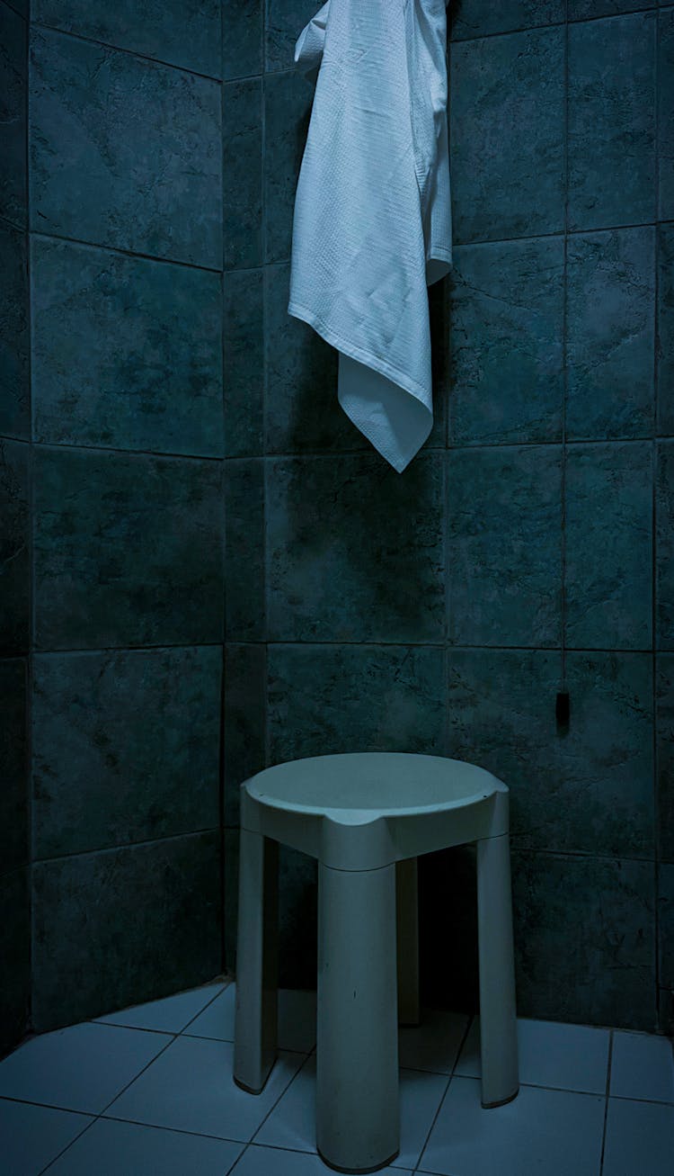 White Bath Towel Hanging On The Wall