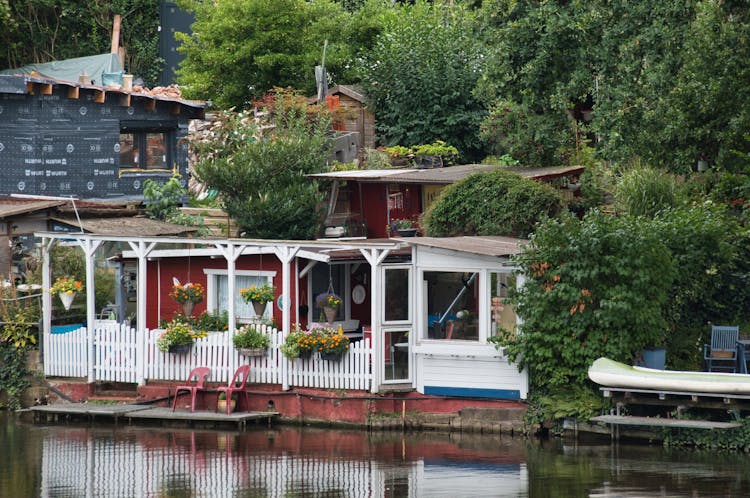 Red Waterfront House In A Rural Area