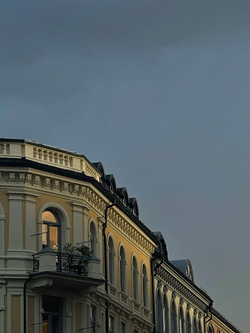 Free Classical Building with Decorative Cornice against Evening Sky Stock Photo