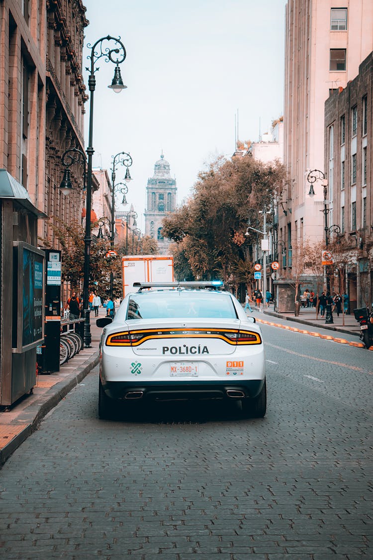 Police Car Parked On Street Side