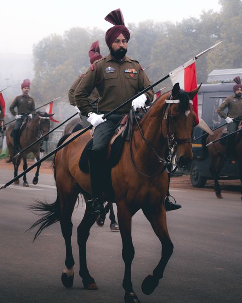 Free Troops of the Indian army in ceremonial uniforms on horseback during a parade. Stock Photo