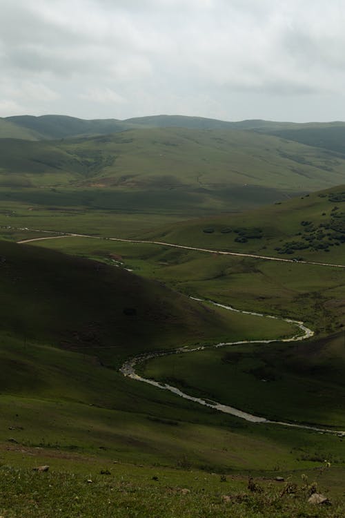 Green Mountain Under Gray Sky