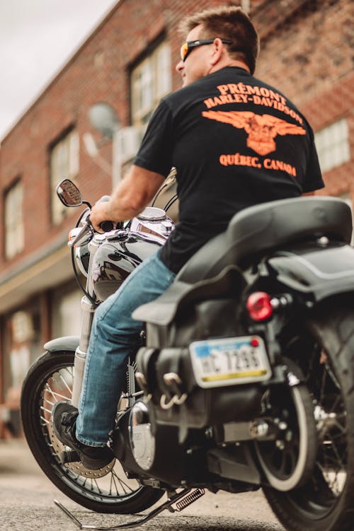 Free Back of a Man Sitting on a Motorcycle Stock Photo