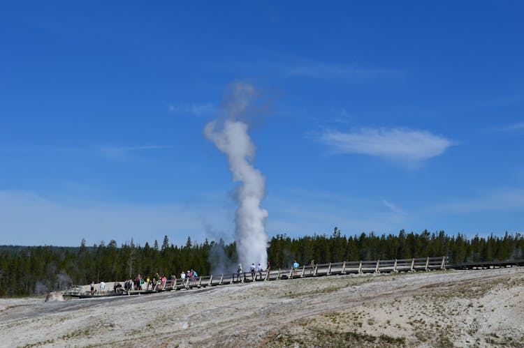 People Watching Geyser Eruption