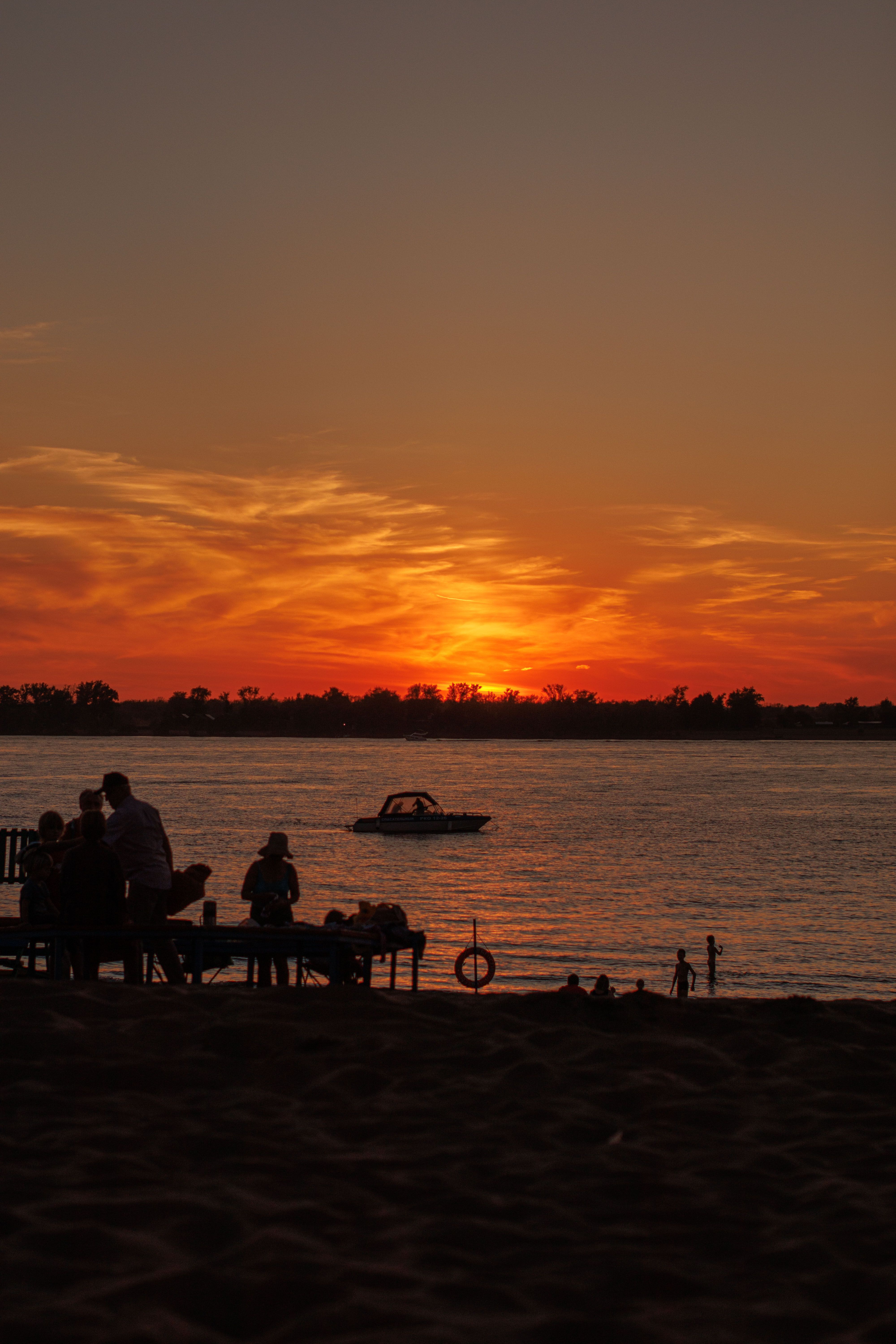 People at the Beach During Sunset · Free Stock Photo