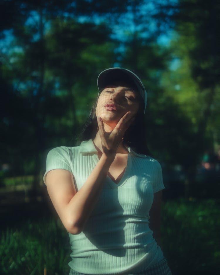 Woman In White Crew Shirt And White Cap 