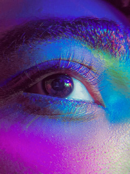 Close-up of a Womans Eye in Colorful Lighting 