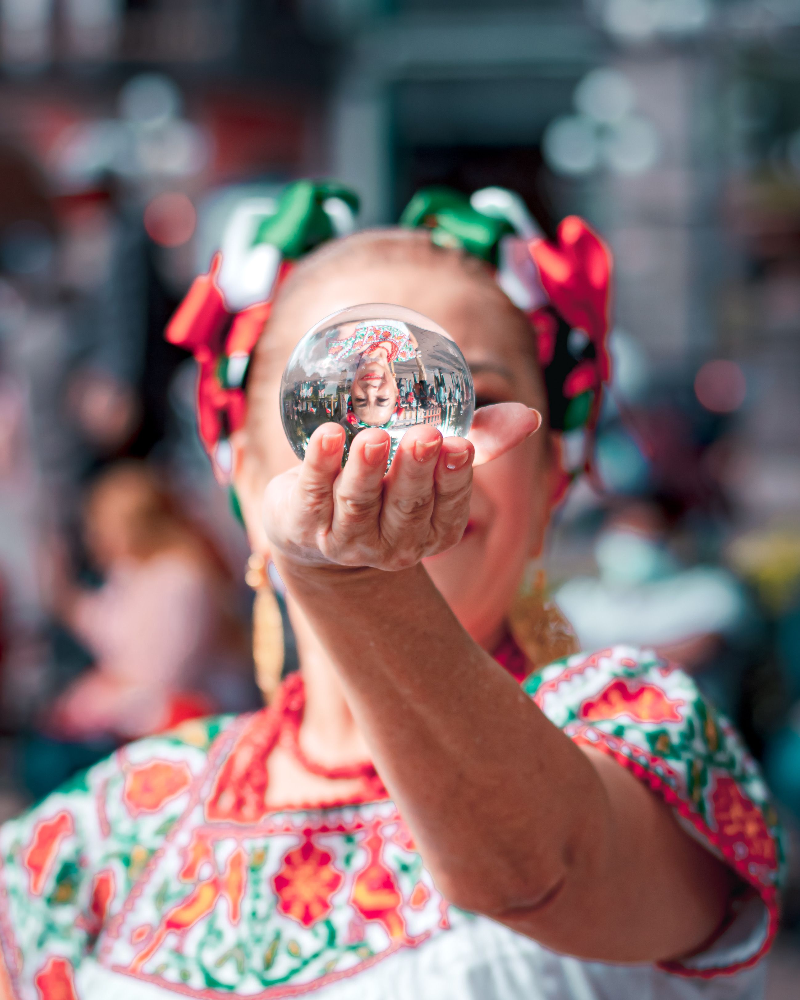 A Woman Holding a Crystal Ball · Free Stock Photo
