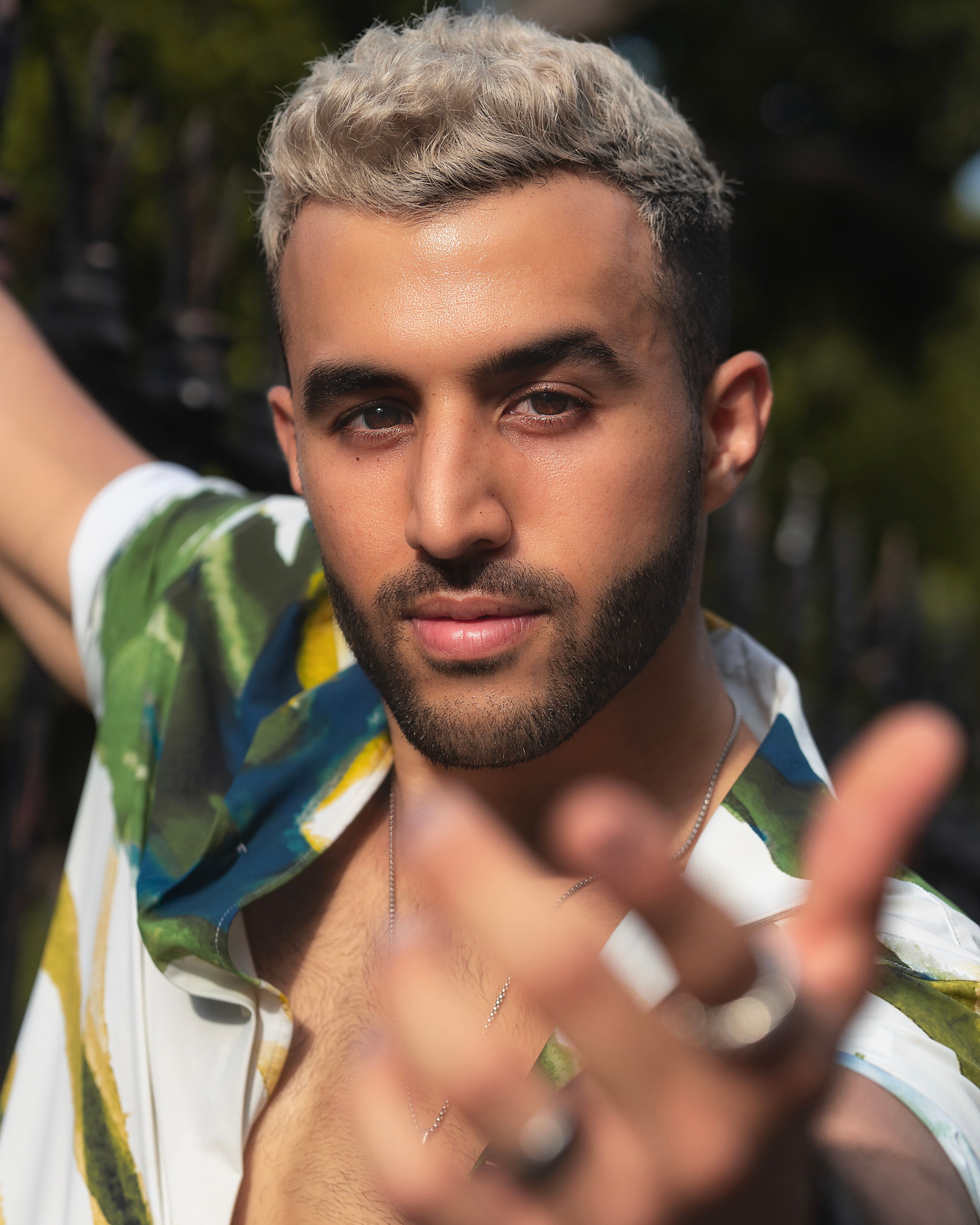Portrait of a handsome bearded man with blond hair outdoors in Mérida, México.