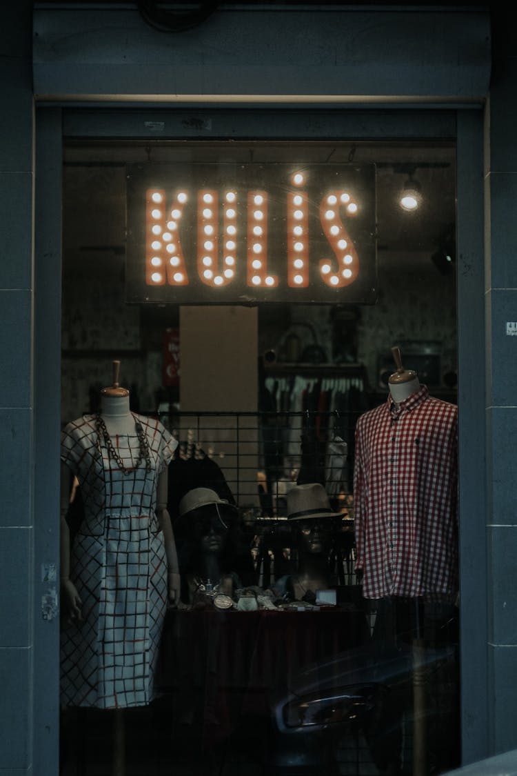 Clothes On Headless Mannequins In A Display Window