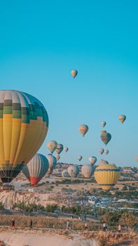 A stunning display of colorful hot air balloons floating over scenic landscapes.