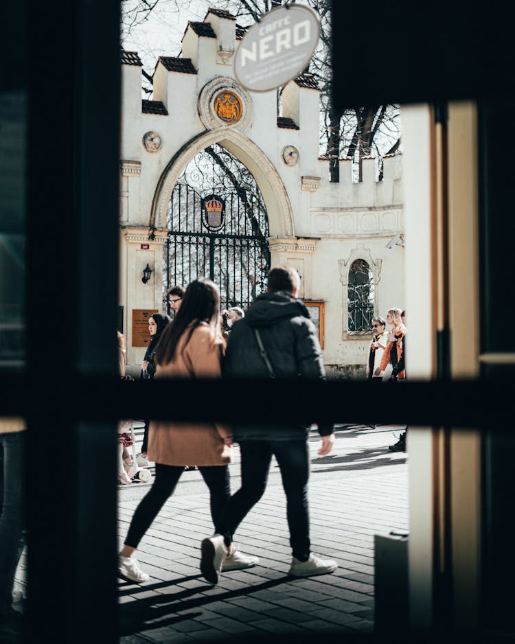 People Walking On Sidewalk