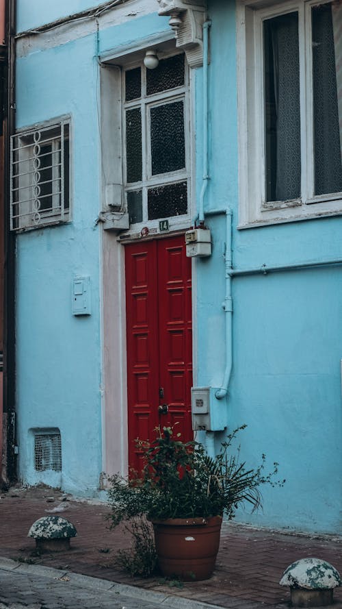 Red Door to a Blue Building 