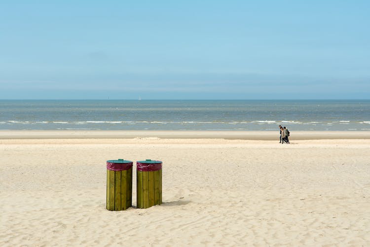 People Walking At The Beach