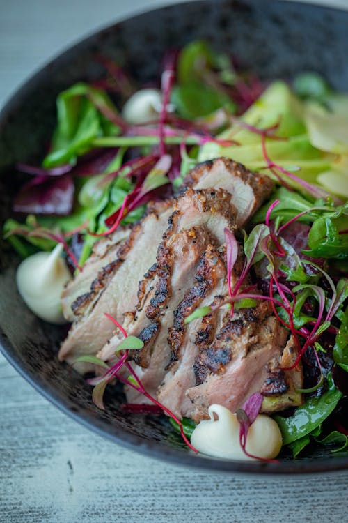 Meal with a Roasted Meat and a Salad