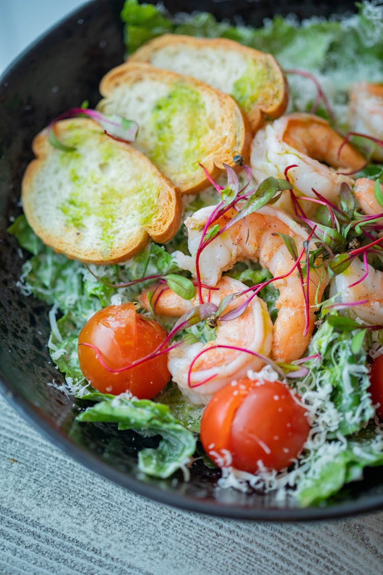 Shrimps And Sliced Bread In A Salad Bowl