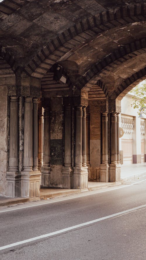 Concrete Pillars Near Asphalt Road